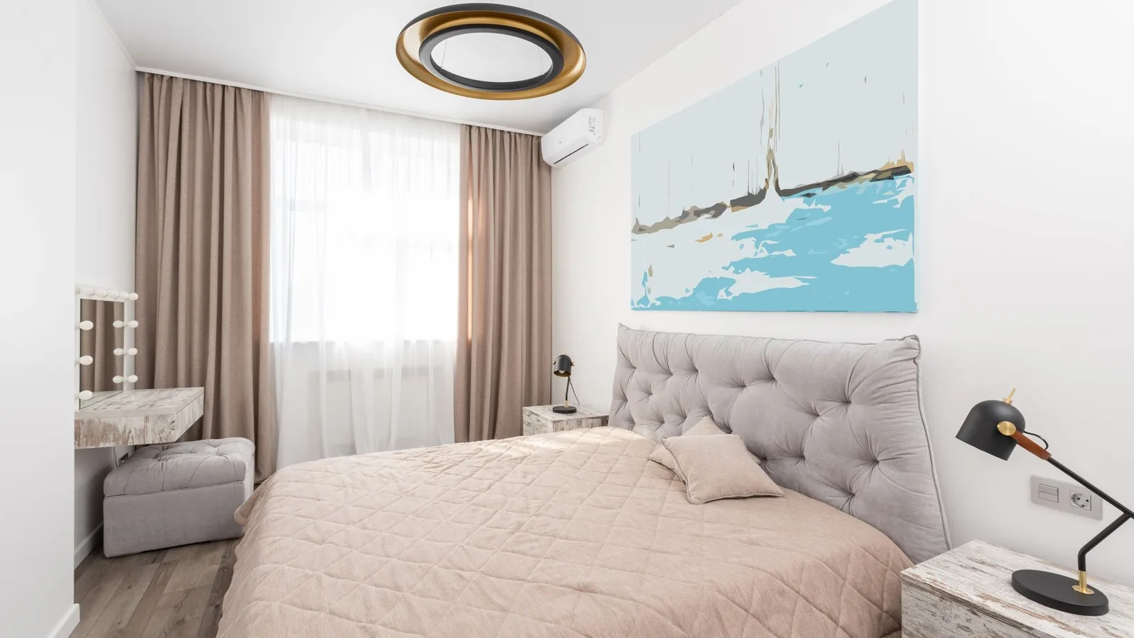 Wall-mounted mini split unit above a bed in a compact bedroom, ideal diy mini split for 250 square feet setup